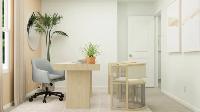 a dining room with furniture and a potted plant