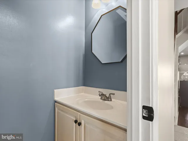 a bathroom with a sink and mirror