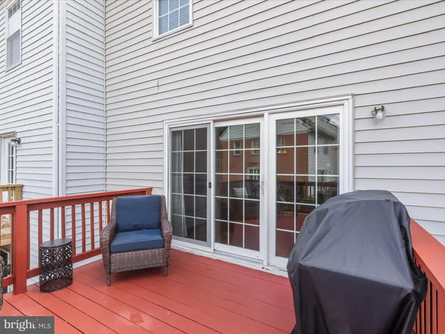 a view of a deck with wooden floor and furniture