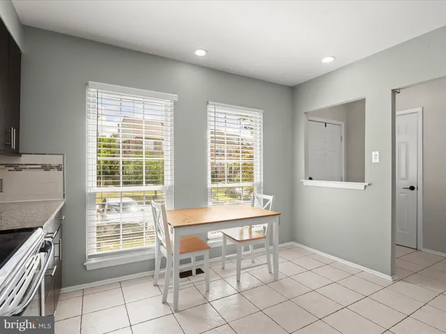 a view of a room with windows and lounge chair