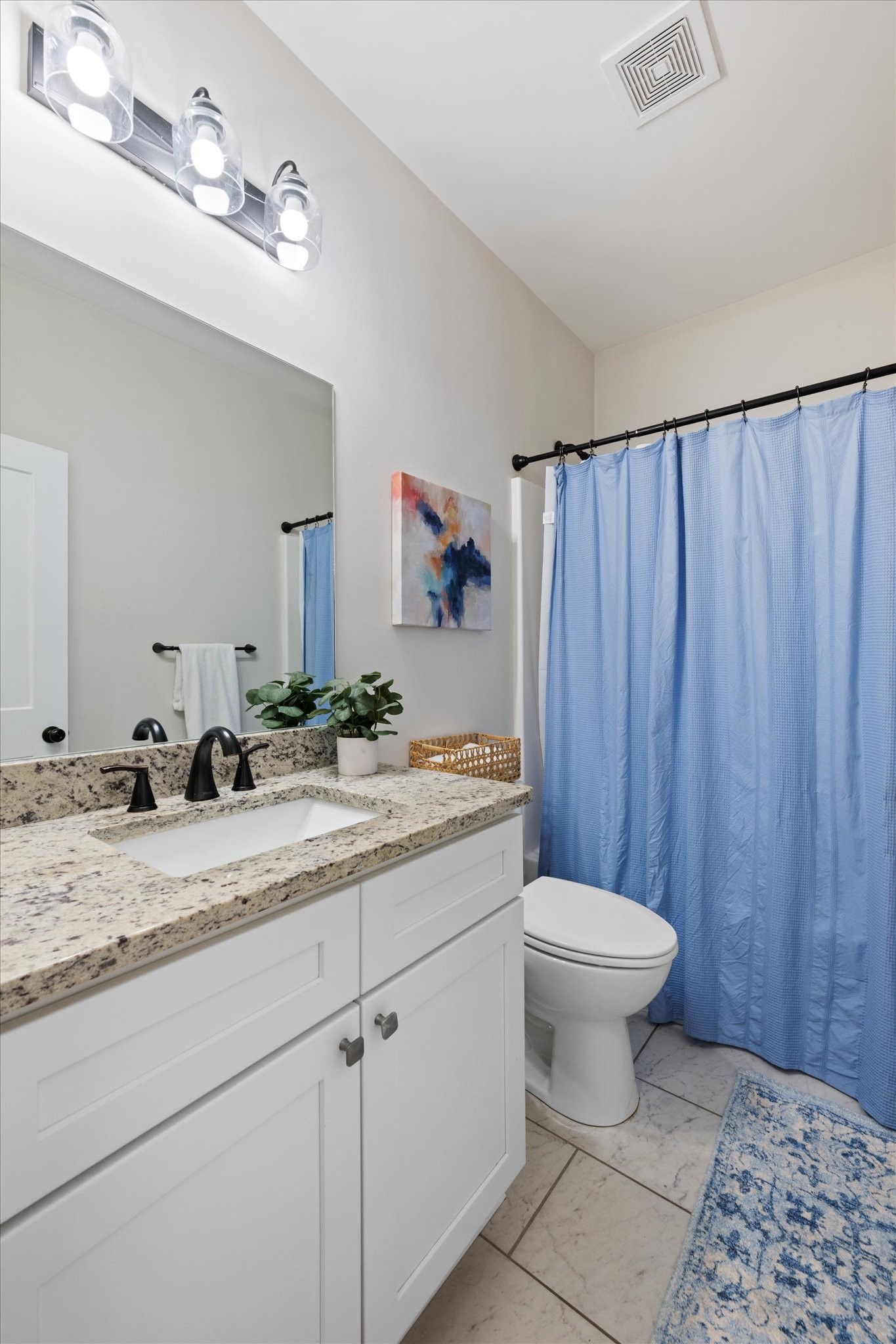 2057 Halls Mill Road Unionville, TN 37180 - Photo 19 of 36 a bathroom with a granite countertop sink toilet and a mirror