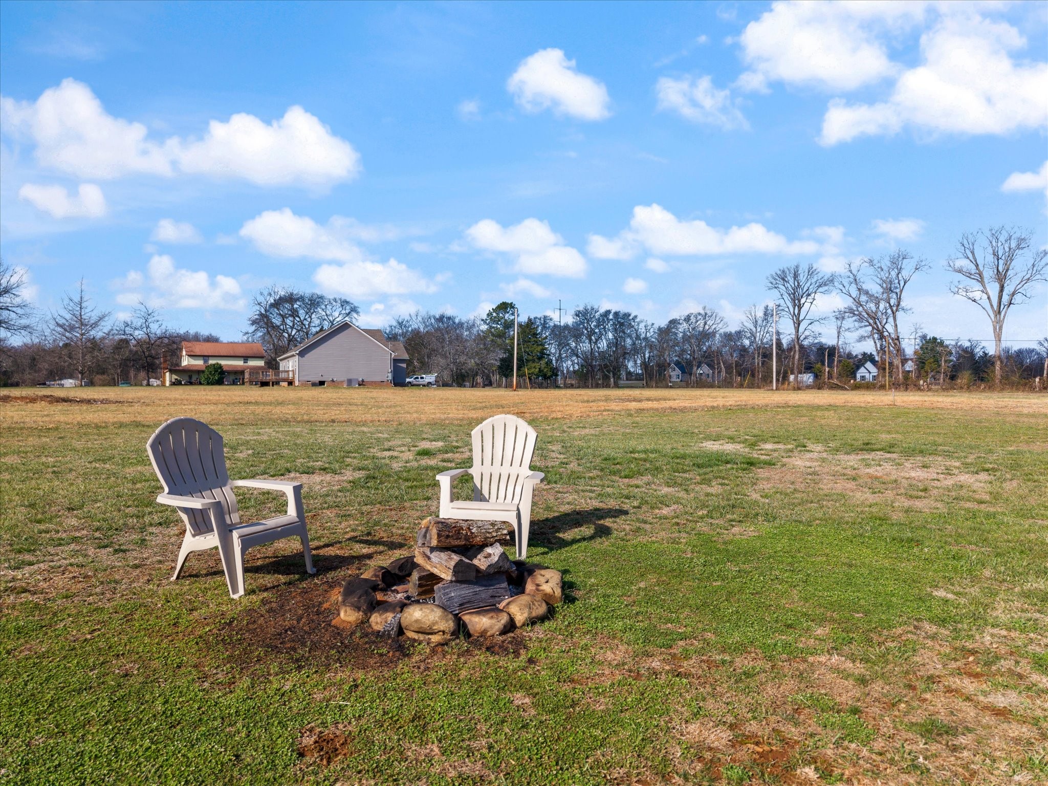 2057 Halls Mill Road Unionville, TN 37180 - Photo 26 of 36 a view of a lake with table and chairs