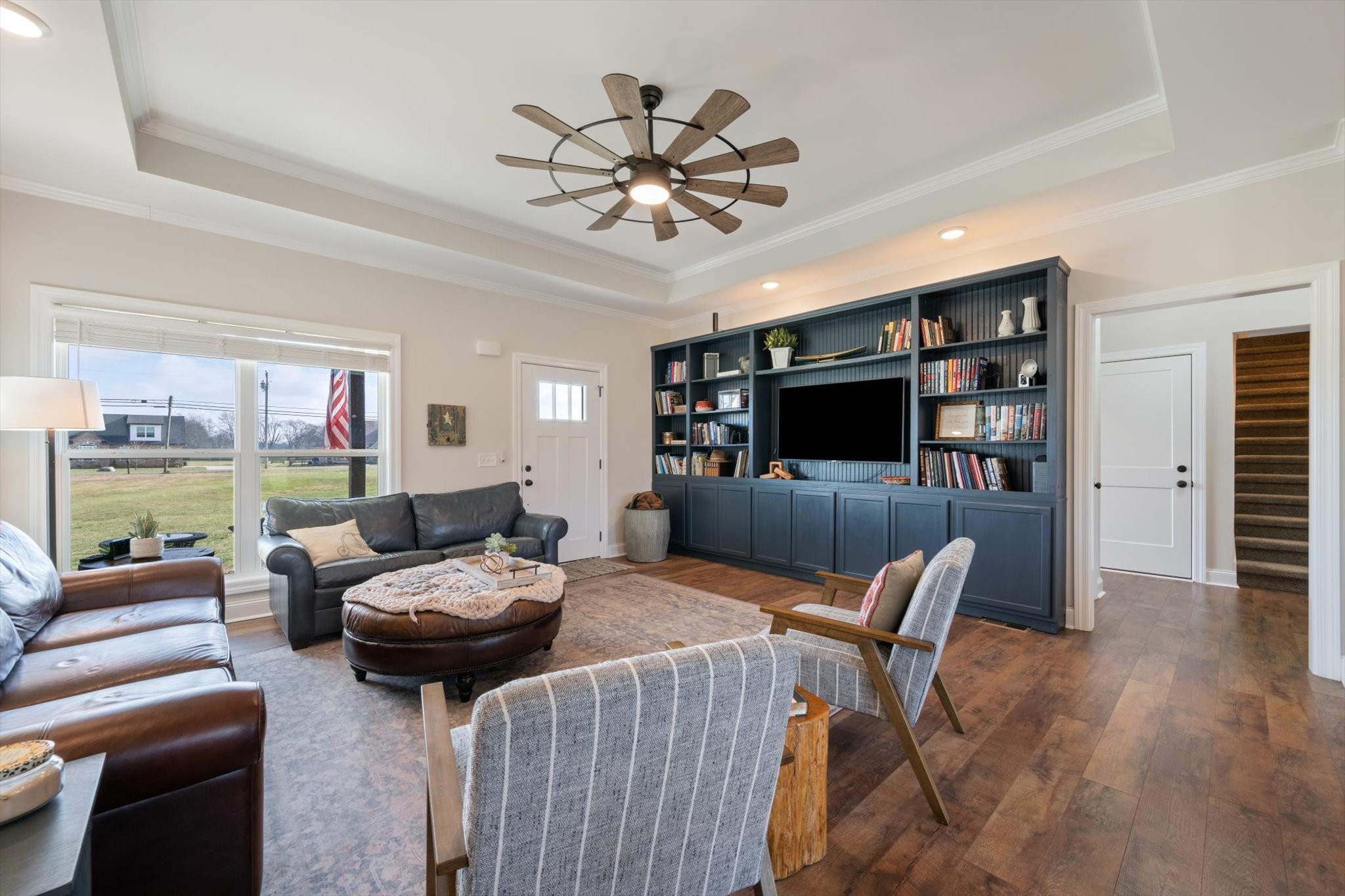2057 Halls Mill Road Unionville, TN 37180 - Photo 7 of 36 a living room with furniture a flat screen tv and kitchen view