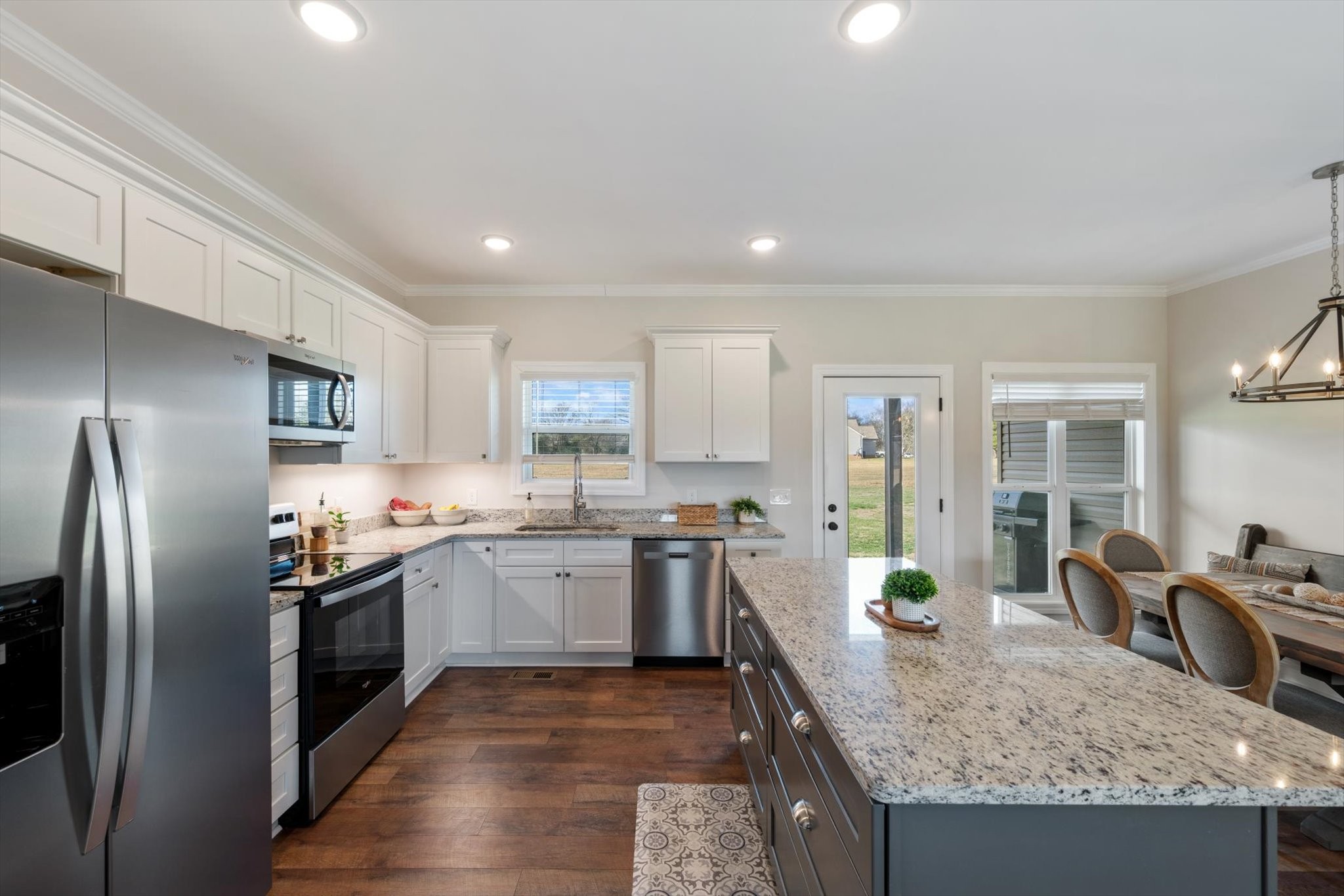 2057 Halls Mill Road Unionville, TN 37180 - Photo 10 of 36 a kitchen with stainless steel appliances granite countertop a sink stove and refrigerator