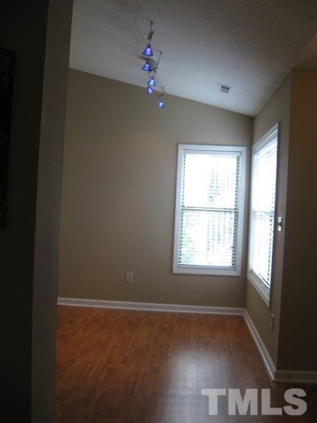 6111 Sunpointe Drive, Unit 201 Raleigh, NC 27606 - Photo 14 of 17 a view of an empty room with a window