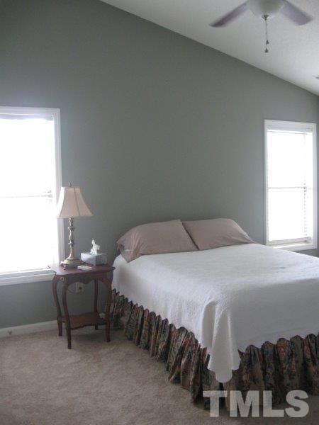 6111 Sunpointe Drive, Unit 201 Raleigh, NC 27606 - Photo 16 of 17 a bedroom with a bed and a window