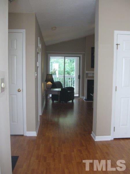 6111 Sunpointe Drive, Unit 201 Raleigh, NC 27606 - Photo 4 of 17 a living room with furniture and a large window