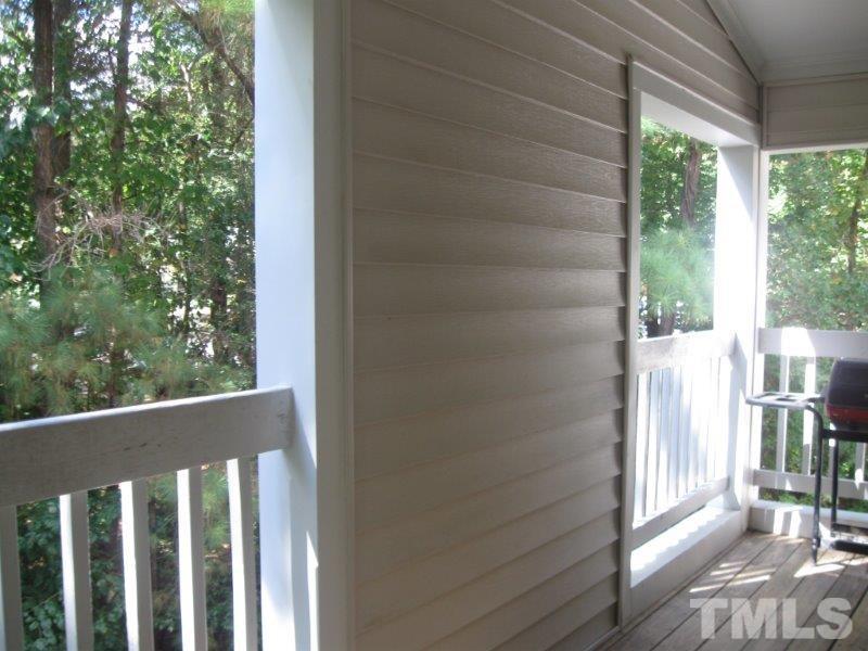 6111 Sunpointe Drive, Unit 201 Raleigh, NC 27606 - Photo 7 of 17 a view of a balcony with wooden floor
