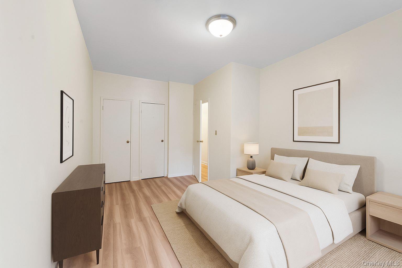 369 Marion Street, Unit 2B Brooklyn, NY 11233 - Photo 5 of 9 a bedroom with a bed and a painting