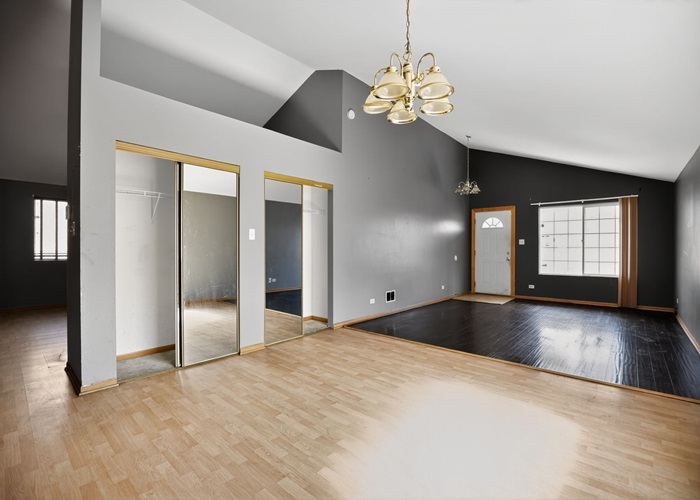 602 Merrill Avenue Calumet City, IL 60409 - Photo 14 of 22 a view of an empty room with window and wooden floor