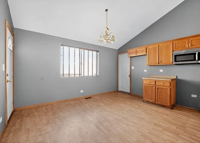 a kitchen with a sink cabinets and window