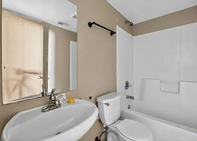 a bathroom with a sink and a toilet