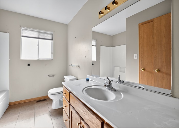 602 Merrill Avenue Calumet City, IL 60409 - Photo 22 of 22 a bathroom with a sink and a toilet
