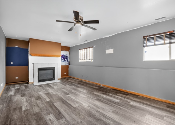 602 Merrill Avenue Calumet City, IL 60409 - Photo 8 of 22 a view of empty room with windows and fireplace