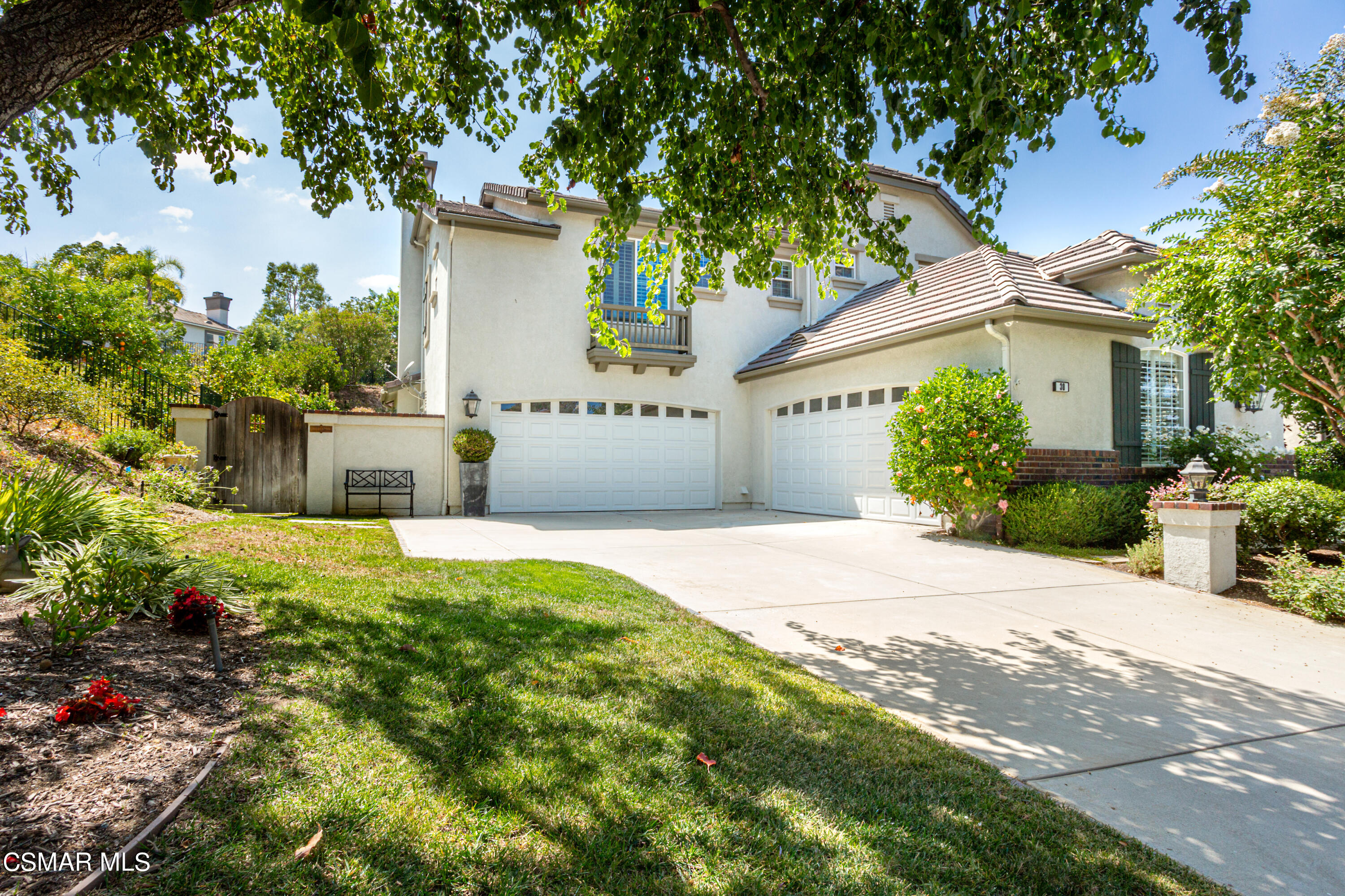 30 West Twisted Oak Drive Simi Valley, CA 93065 - Photo 2 of 45 a front view of a house with a garden