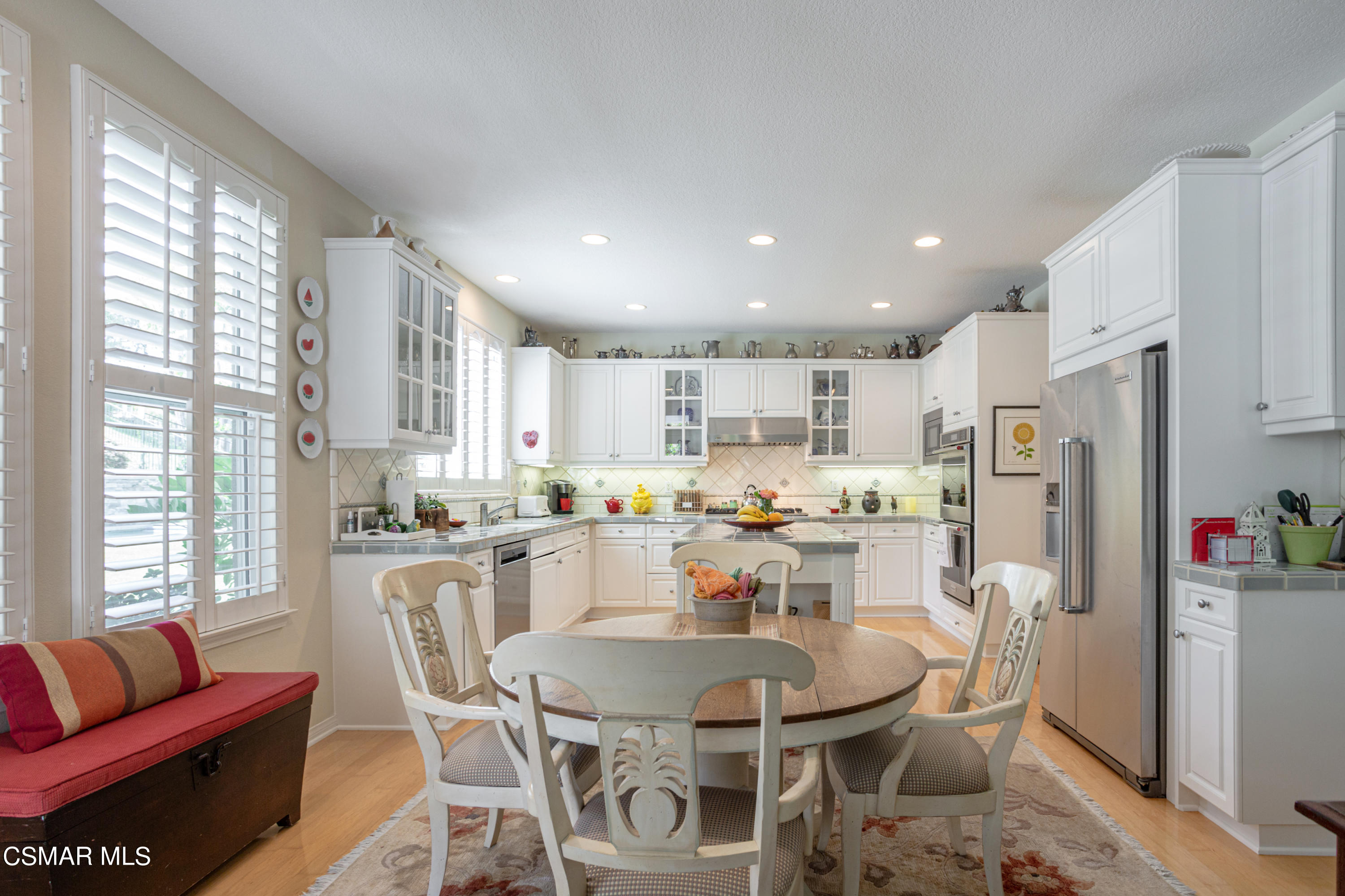 30 West Twisted Oak Drive Simi Valley, CA 93065 - Photo 14 of 45 a dining room with furniture a kitchen view and appliances