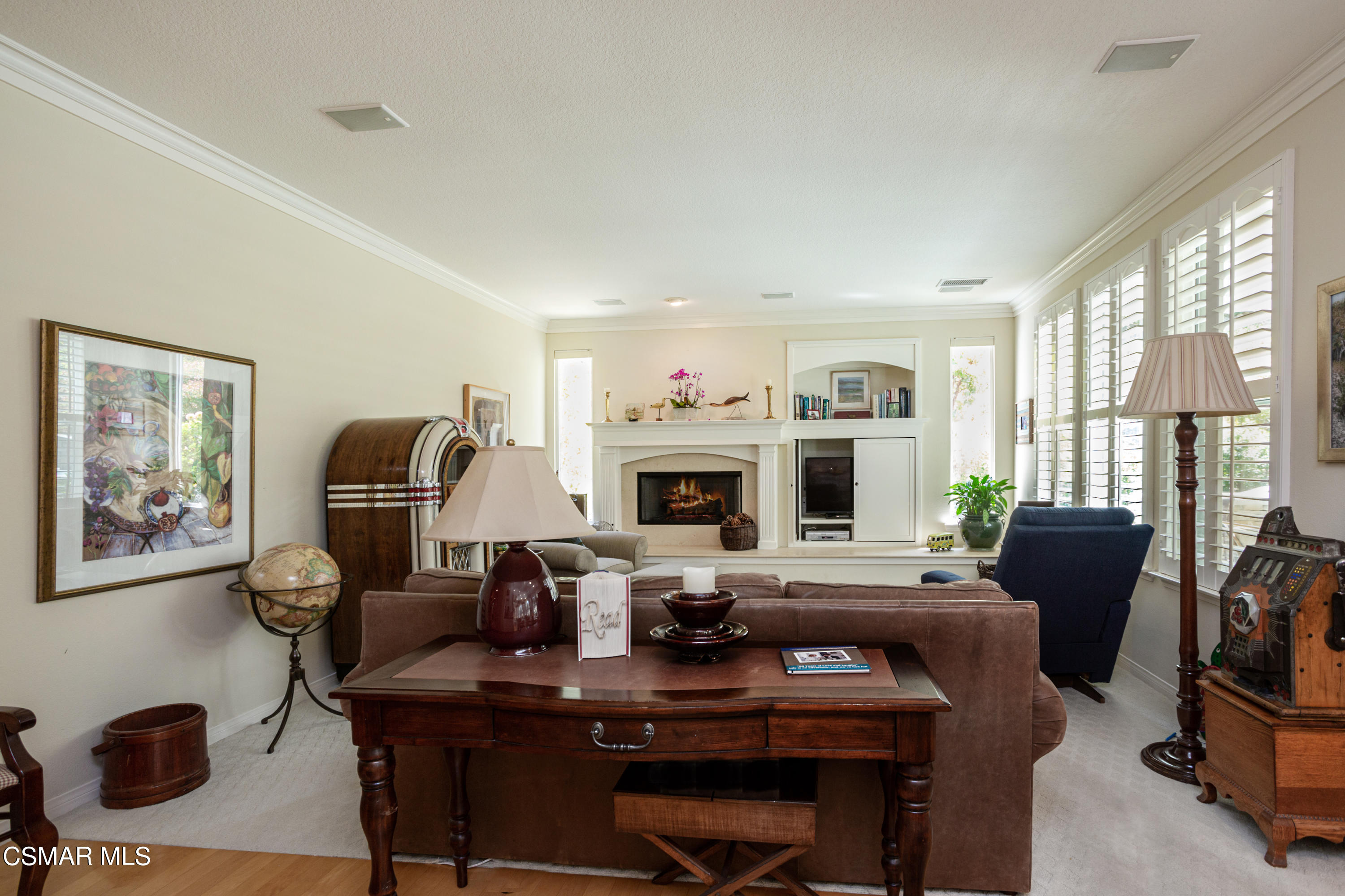 30 West Twisted Oak Drive Simi Valley, CA 93065 - Photo 15 of 45 a living room with furniture a flat screen tv and a fireplace