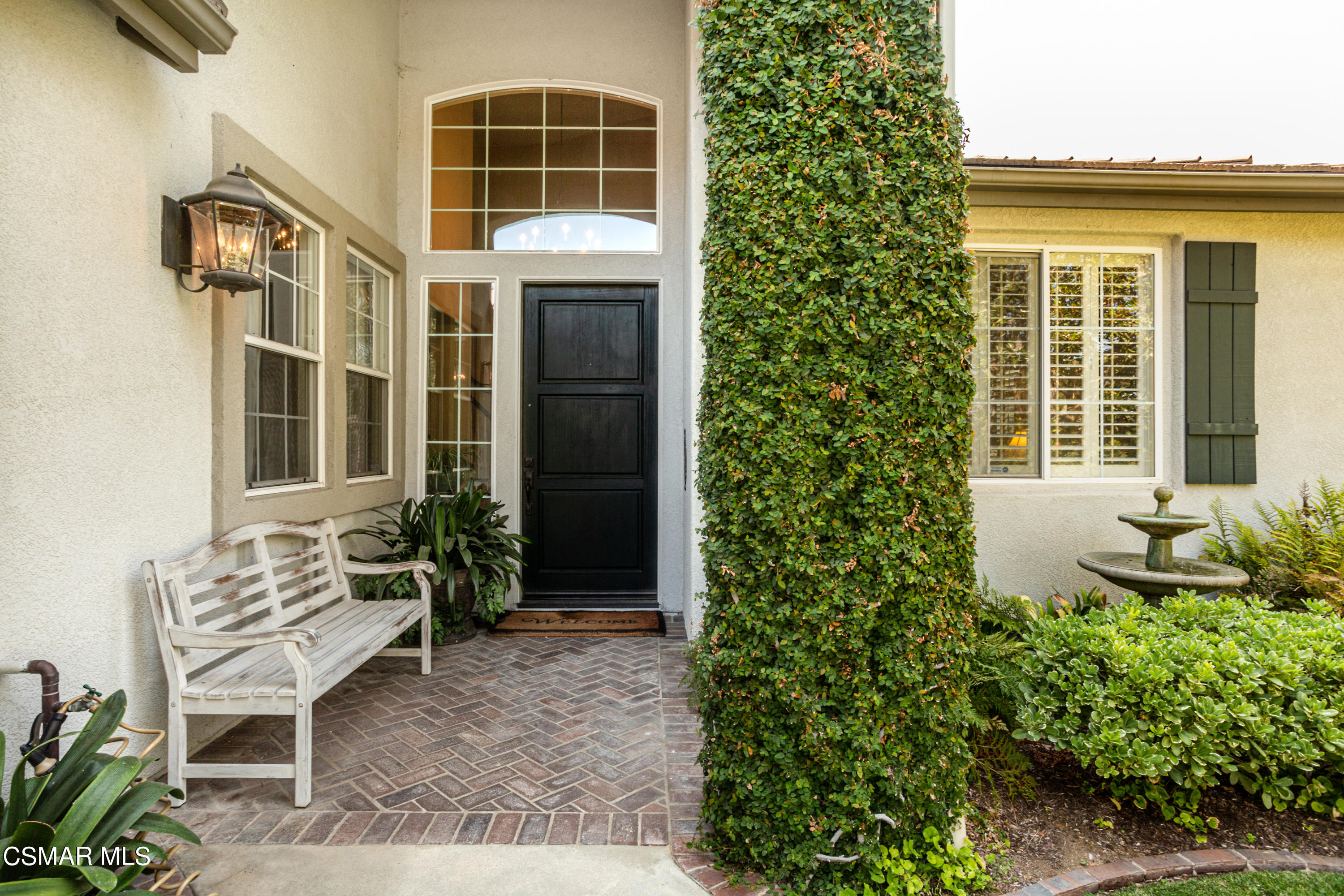 30 West Twisted Oak Drive Simi Valley, CA 93065 - Photo 3 of 45 a front view of a house with outdoor seating and plants
