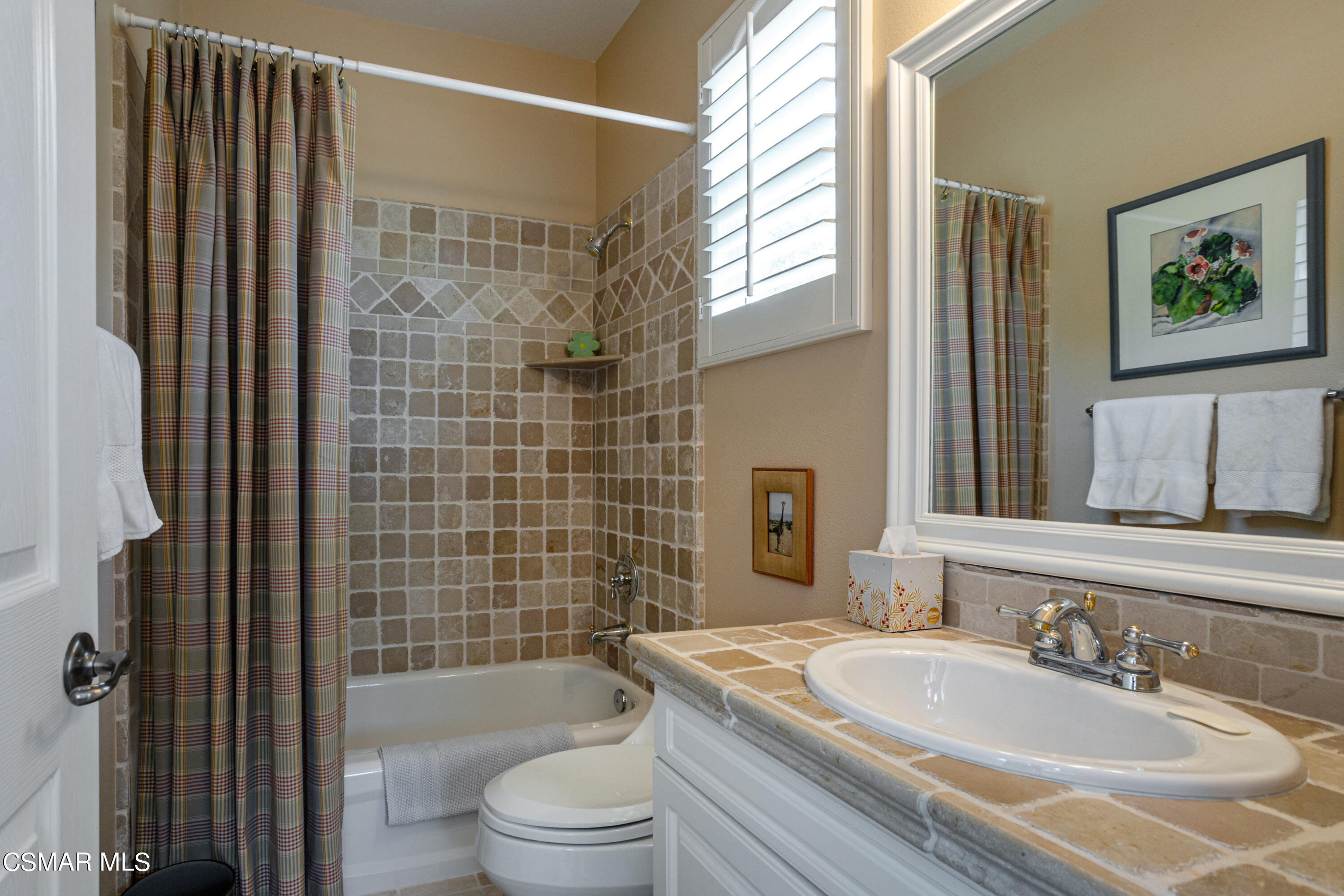 30 West Twisted Oak Drive Simi Valley, CA 93065 - Photo 27 of 45 a bathroom with a granite countertop bathtub sink vanity mirror and toilet