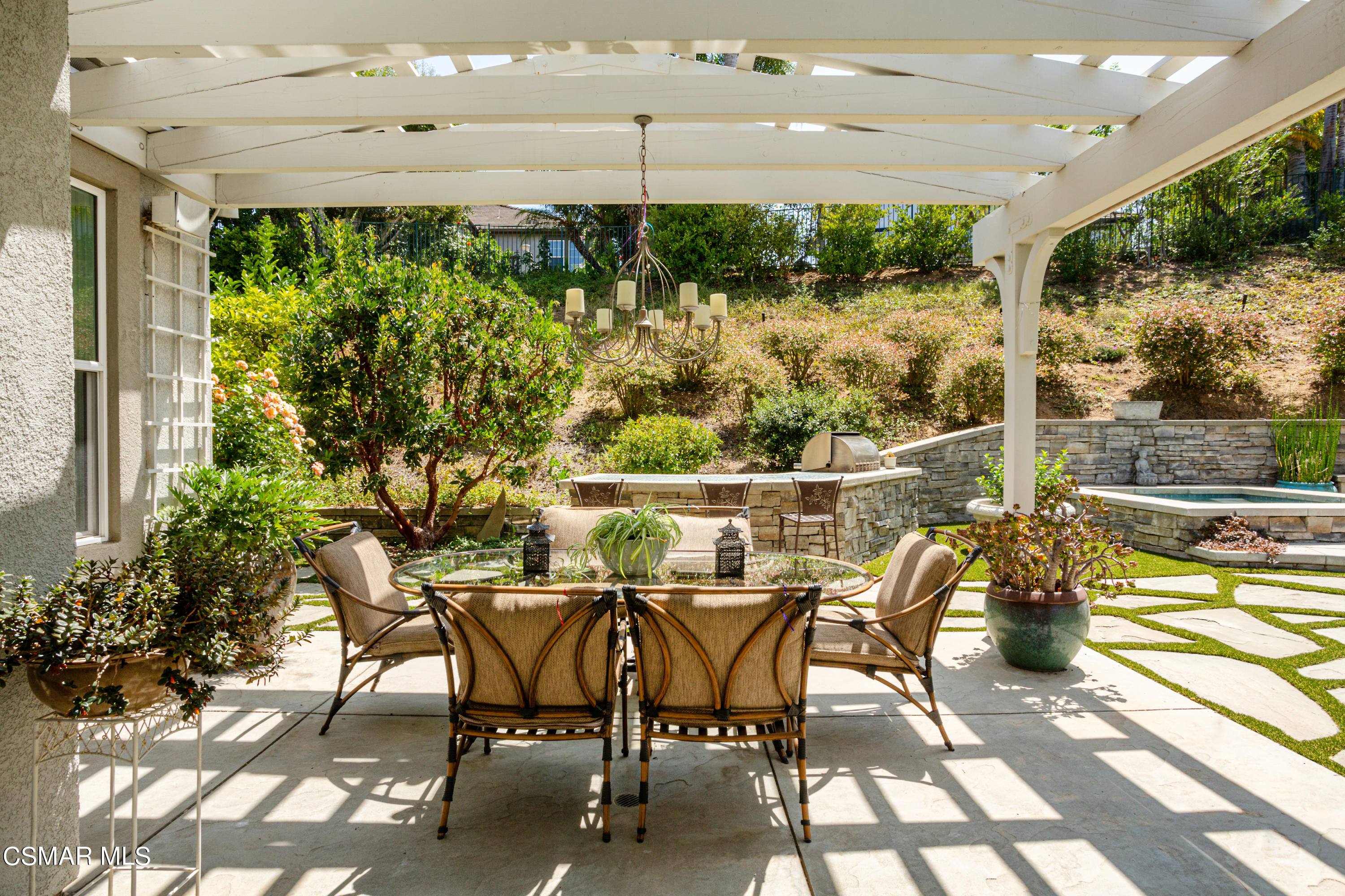30 West Twisted Oak Drive Simi Valley, CA 93065 - Photo 35 of 45 a view of a patio with table and chairs and potted plants