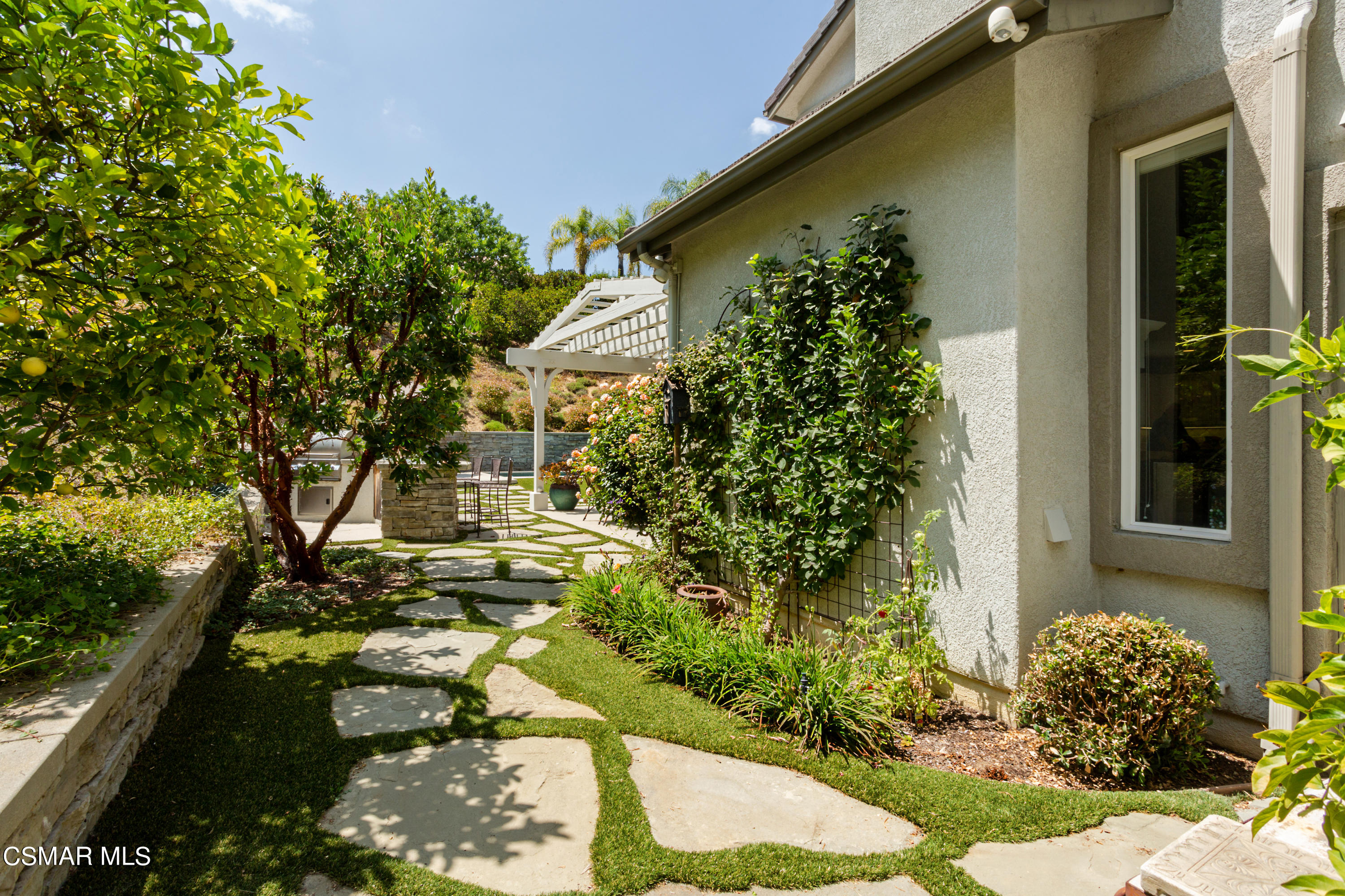 30 West Twisted Oak Drive Simi Valley, CA 93065 - Photo 37 of 45 a view of a house with a flower garden
