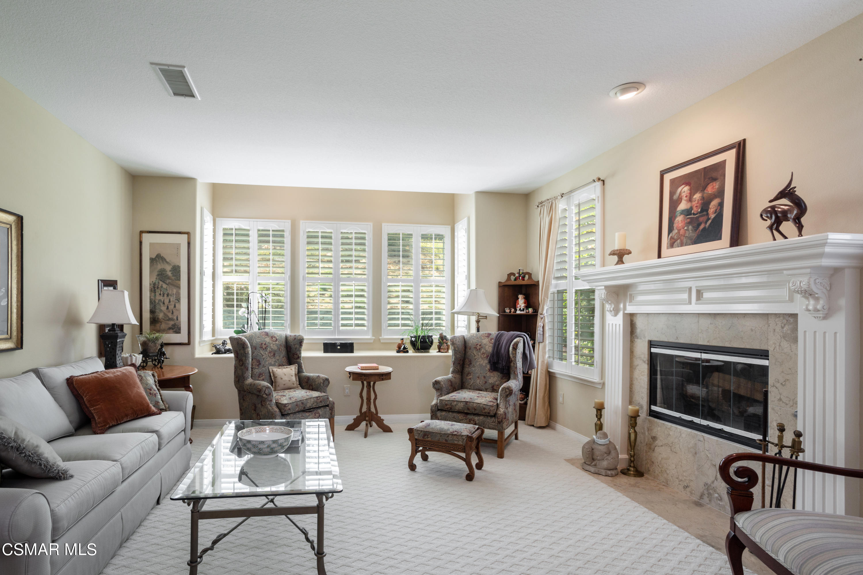 30 West Twisted Oak Drive Simi Valley, CA 93065 - Photo 8 of 45 a living room with furniture a large window and a fireplace