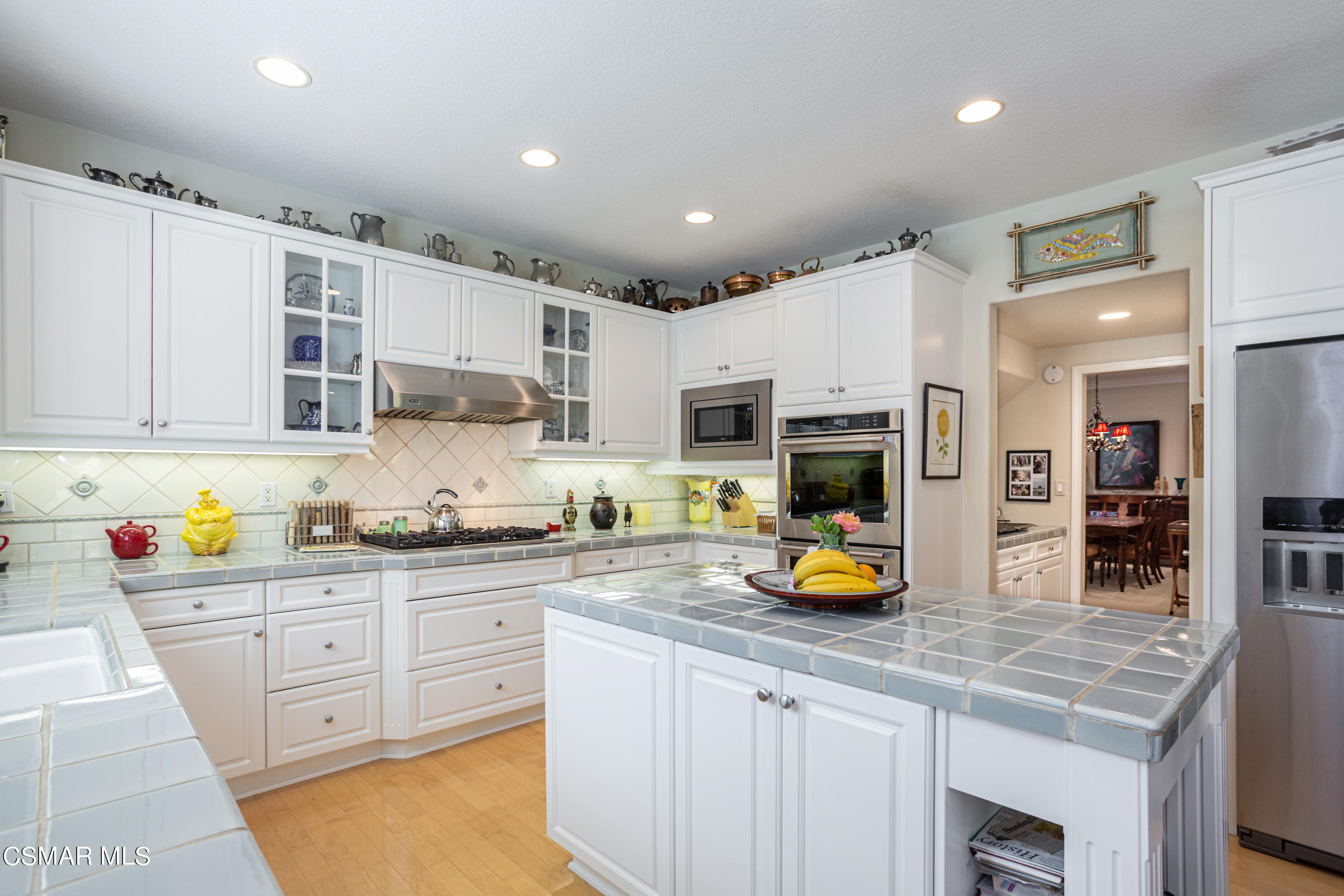 30 West Twisted Oak Drive Simi Valley, CA 93065 - Photo 10 of 45 a kitchen with stainless steel appliances granite countertop a sink and cabinets
