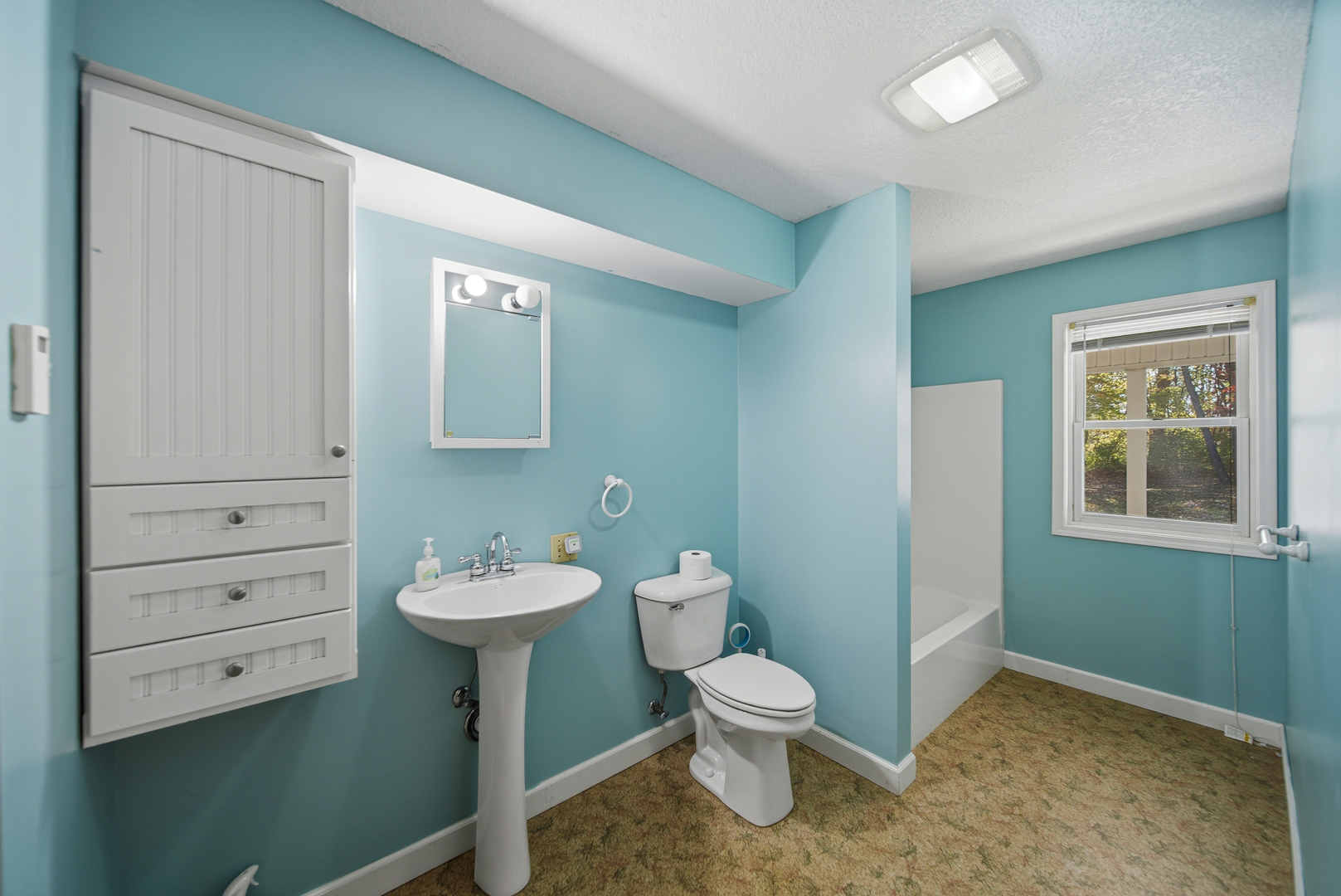 15207 Henry Road Morrison, IL 61270 - Photo 12 of 46 a bathroom with a toilet sink and mirror