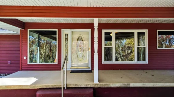 a front view of a house with a porch