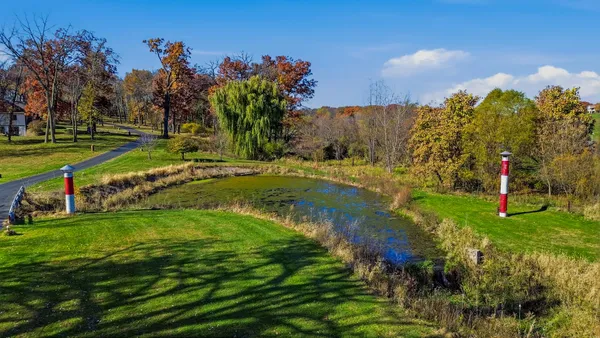a view of a garden with a lake