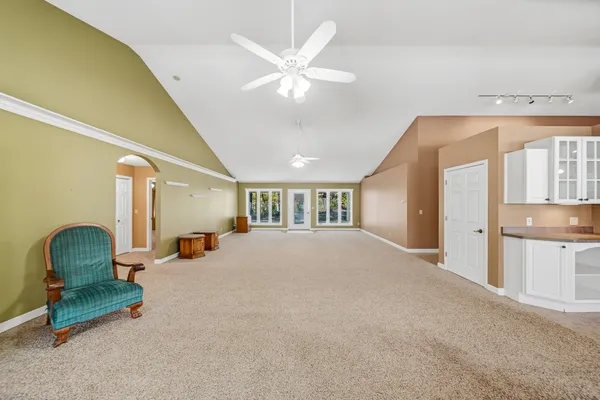 a bedroom with furniture and a chandelier