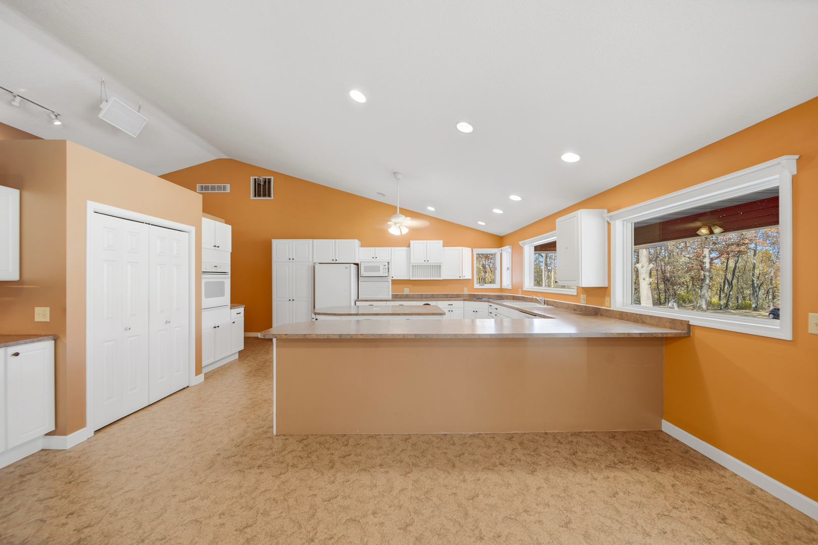 15207 Henry Road Morrison, IL 61270 - Photo 6 of 46 a view of open kitchen with a sink and large window