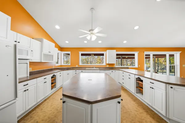 a kitchen with stainless steel appliances granite countertop a sink and cabinets
