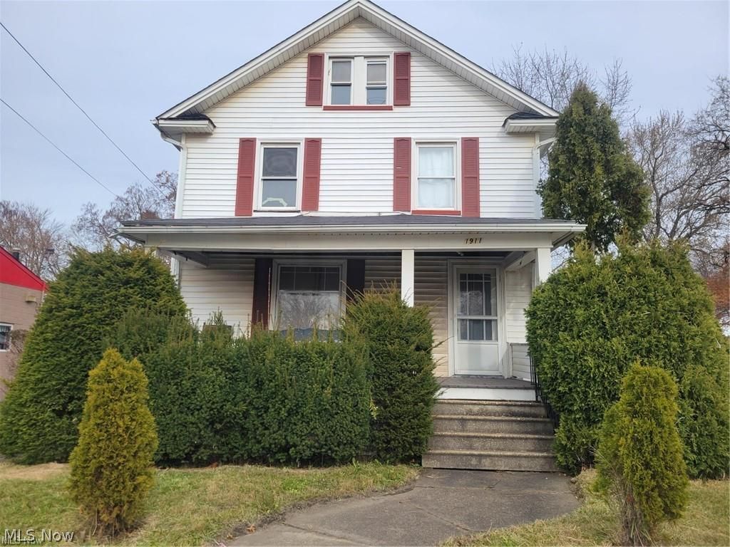 1911 Youngstown Road Southeast Warren, OH 44484 - Photo 1 of 17 American foursquare style home with covered porch
