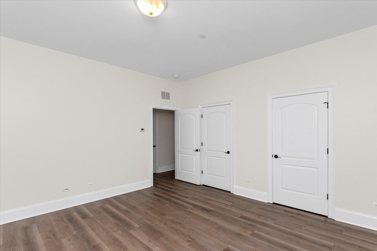 2500 Green Bay Road, Unit 403 Evanston, IL 60201 - Photo 15 of 16 a view of an empty room with wooden floor