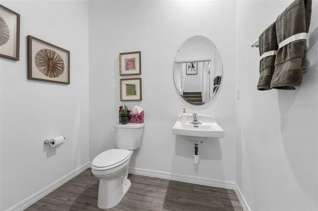 a bathroom with a toilet and a sink