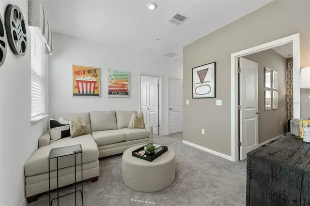 a living room with furniture and a window