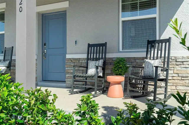 front view of a house with outdoor seating