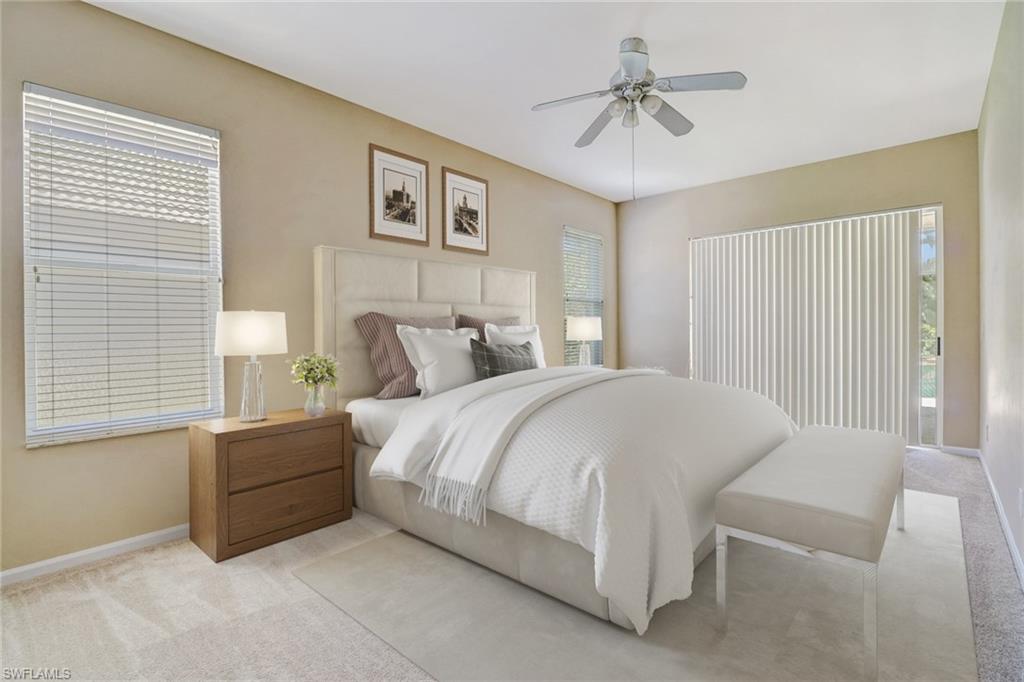 6564 Chestnut Circle Naples, FL 34109 - Photo 12 of 27 a bedroom with a bed and a chandelier
