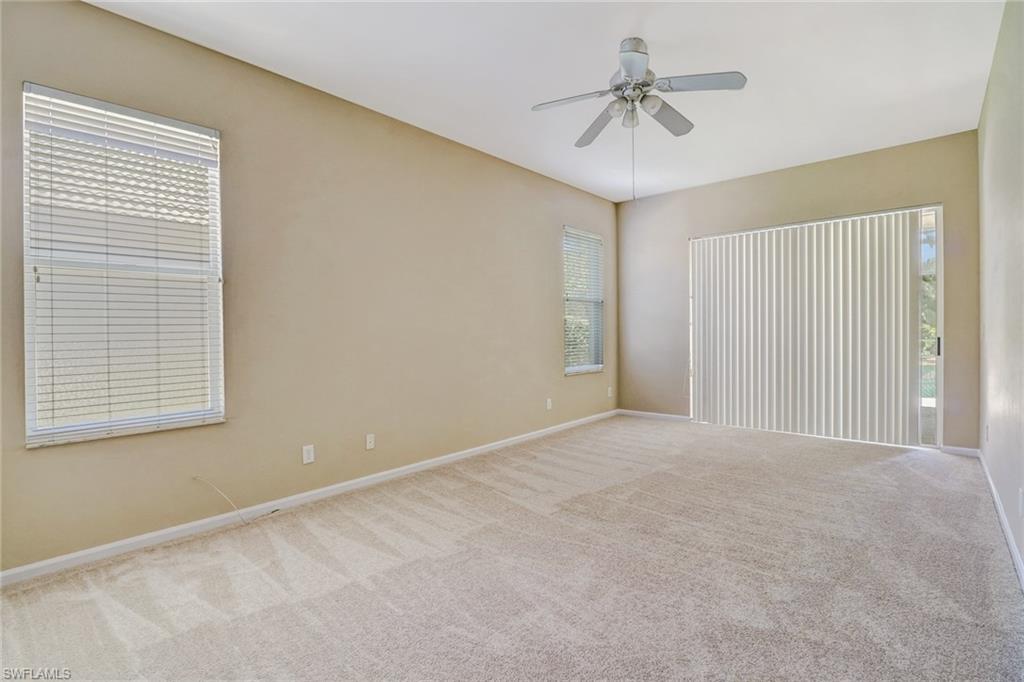 6564 Chestnut Circle Naples, FL 34109 - Photo 13 of 27 a view of an empty room with a window