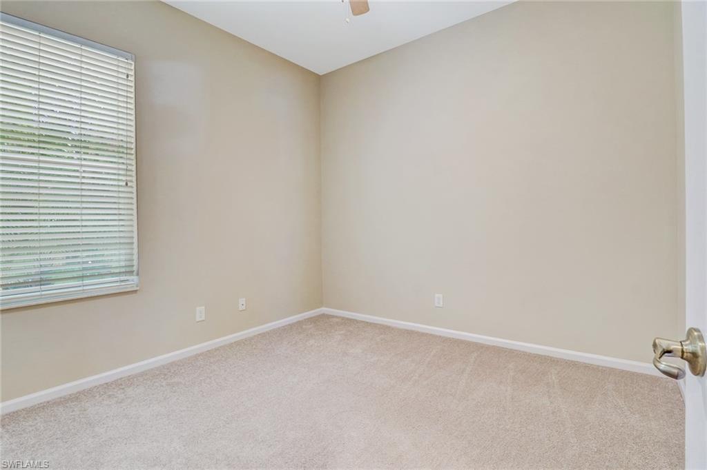 6564 Chestnut Circle Naples, FL 34109 - Photo 20 of 27 an empty room with a window