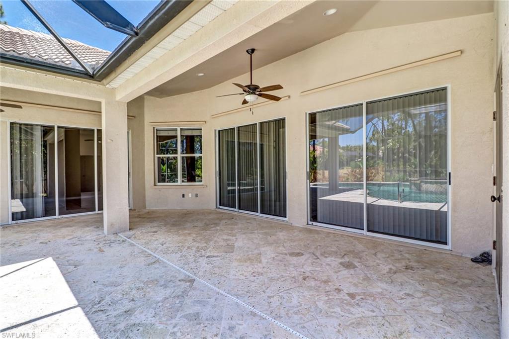 6564 Chestnut Circle Naples, FL 34109 - Photo 25 of 27 a view of an empty room with glass door