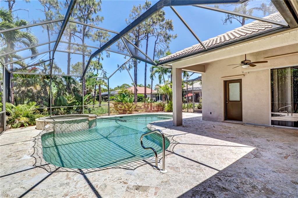 6564 Chestnut Circle Naples, FL 34109 - Photo 26 of 27 a building outdoor space with patio furniture and potted plants