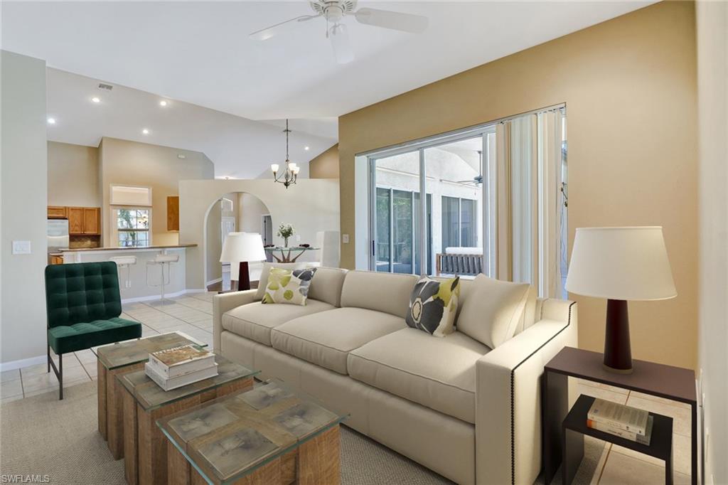 6564 Chestnut Circle Naples, FL 34109 - Photo 4 of 27 a living room with furniture and a window