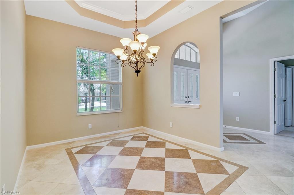 6564 Chestnut Circle Naples, FL 34109 - Photo 8 of 27 a view of an empty room with a window