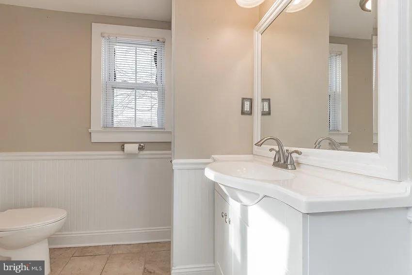 4090 Old Town Road Huntingtown, MD 20639 - Photo 13 of 20 a bathroom with a sink and a toilet