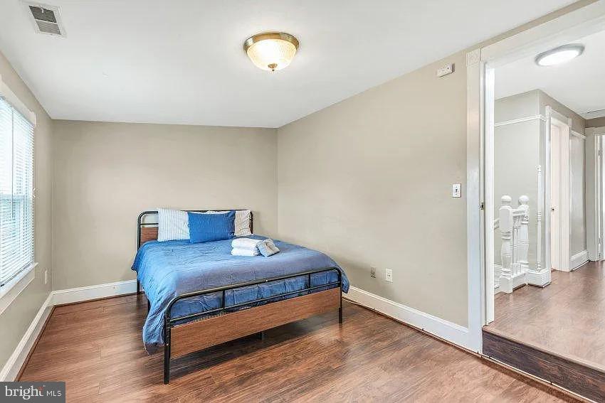 4090 Old Town Road Huntingtown, MD 20639 - Photo 14 of 20 a bedroom with a bed and a table