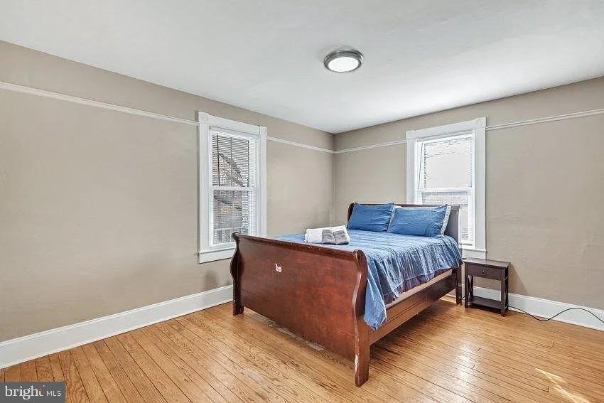 4090 Old Town Road Huntingtown, MD 20639 - Photo 15 of 20 a spacious bedroom with a bed and a window
