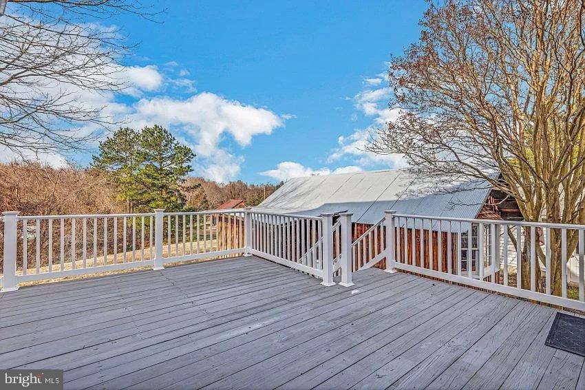 4090 Old Town Road Huntingtown, MD 20639 - Photo 19 of 20 a view of deck with wooden floor and fence