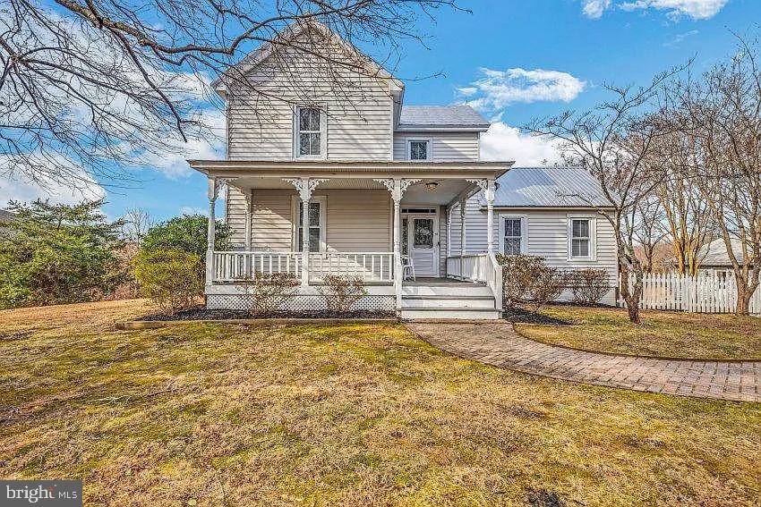 4090 Old Town Road Huntingtown, MD 20639 - Photo 2 of 20 a front view of a house with a yard